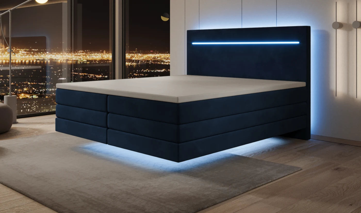 Schwebendes Boxspringbett in Samt Blau bei Nacht mit LED