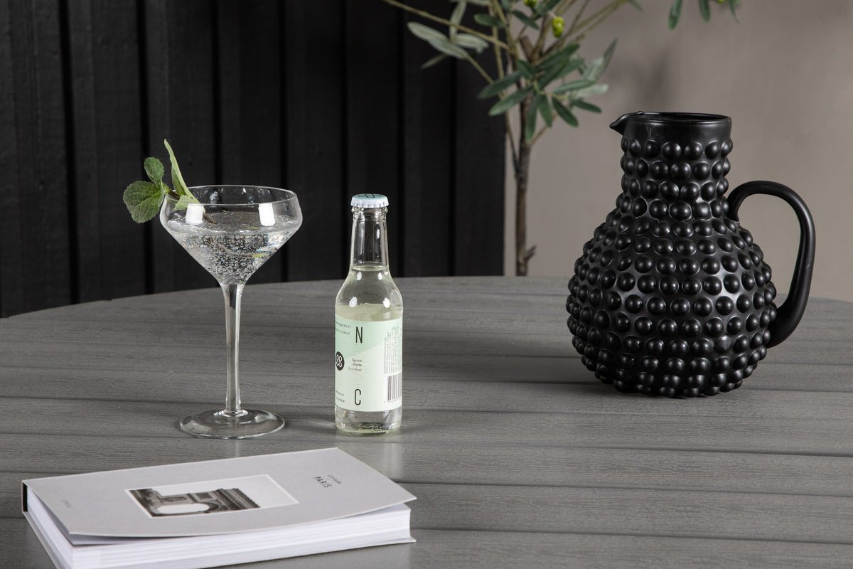 Table de jardin Aviani - ronde, accueillante et élégante