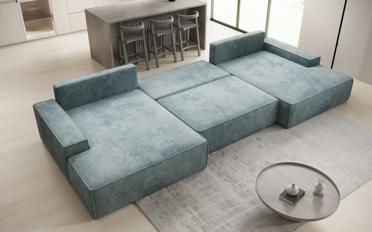 Designsofa Verona U met brede ottomane, slaapfunctie en opbergruimte in Ribstof